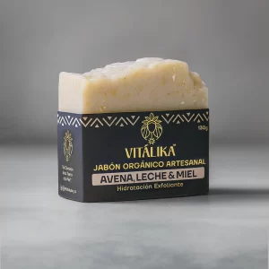 jabón orgánico vitalika de avena leche y miel sobre fondo oscuro